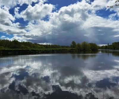 A blue sky reflecting on the River Tees.