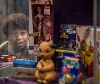 Child looking through glass at popular toys from the 1980s 