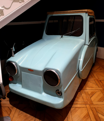 Light blue three-wheeled vehicle in the museum