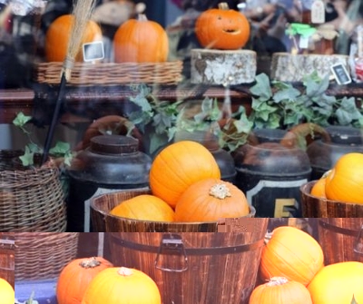 A batch of pumpkins outside on a Halloween display.