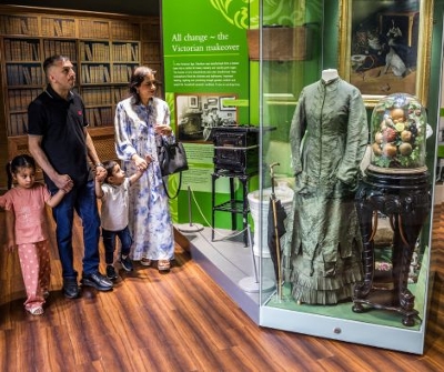 Family viewing showcase inside museum