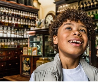 Young boy looking at wonder in the traditional chemist on the Victorian Street 