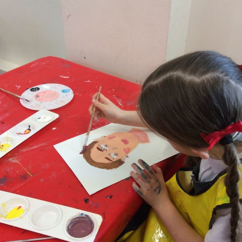 School Child Painting A Self Portrait