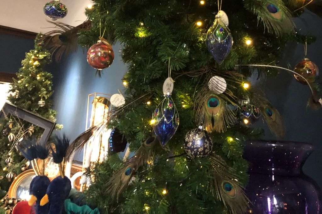 Upside Down Christmas Tree Decorated With Peacock Feathers And Baubles