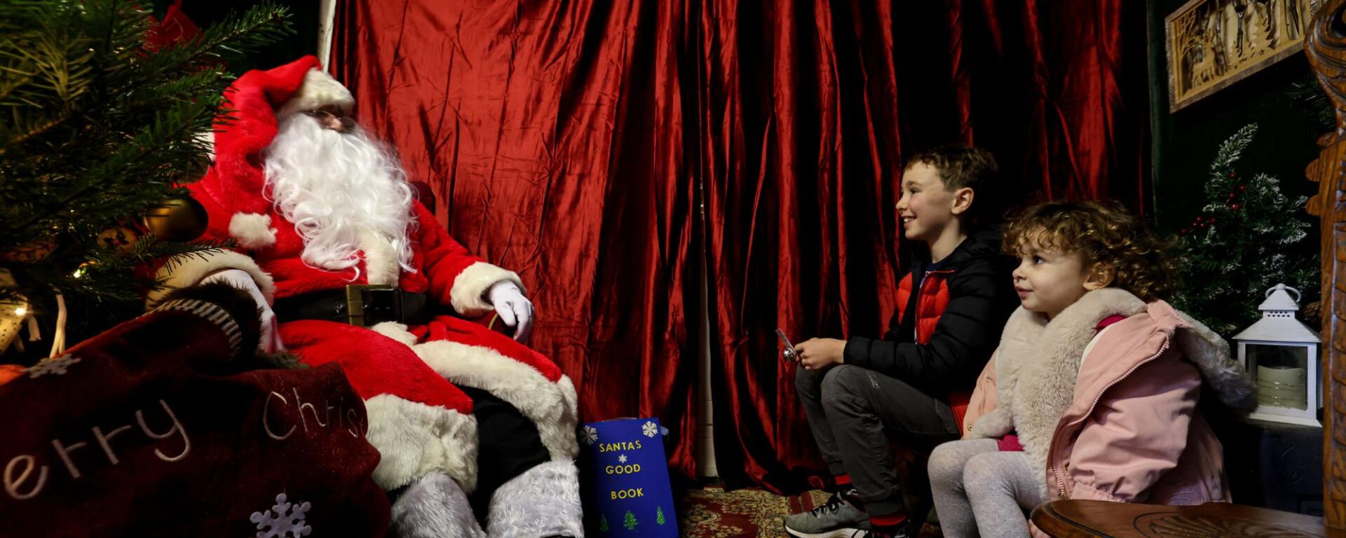 Meet Father Christmas in his grotto on the Victorian Street